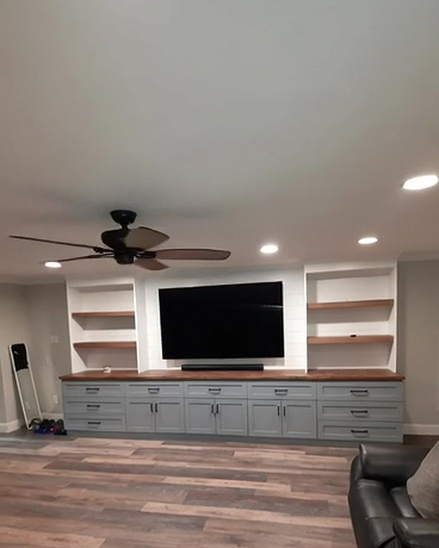 Custom media wall built-in with floating shelves